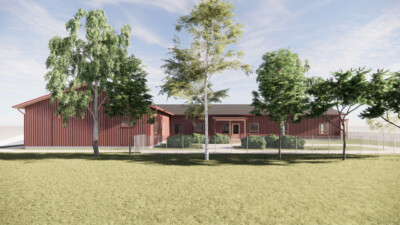 Havainnekuva ruskeasta yksikerroksisesta puurakennuksesta.